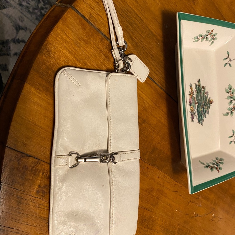 Small cream colored coach wristlet